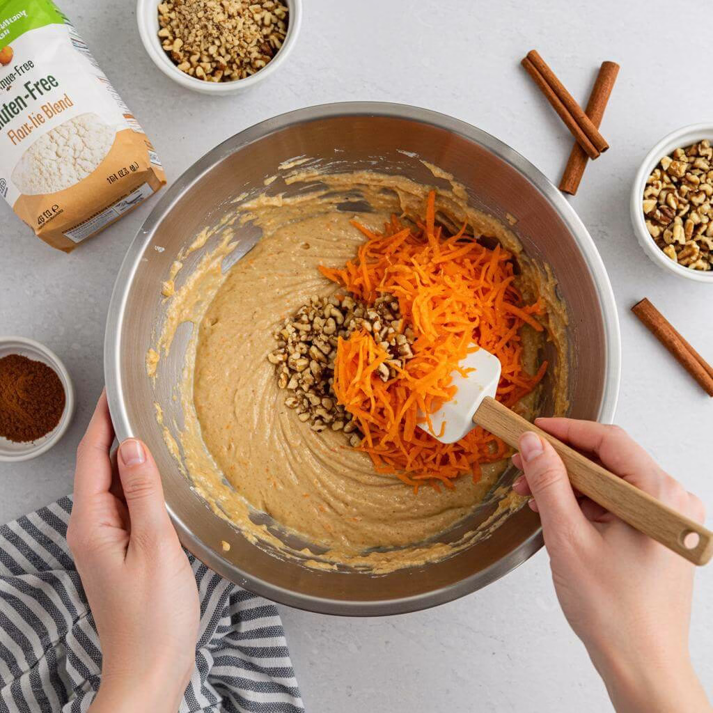 Folding ingredients into gluten free carrot cake batter